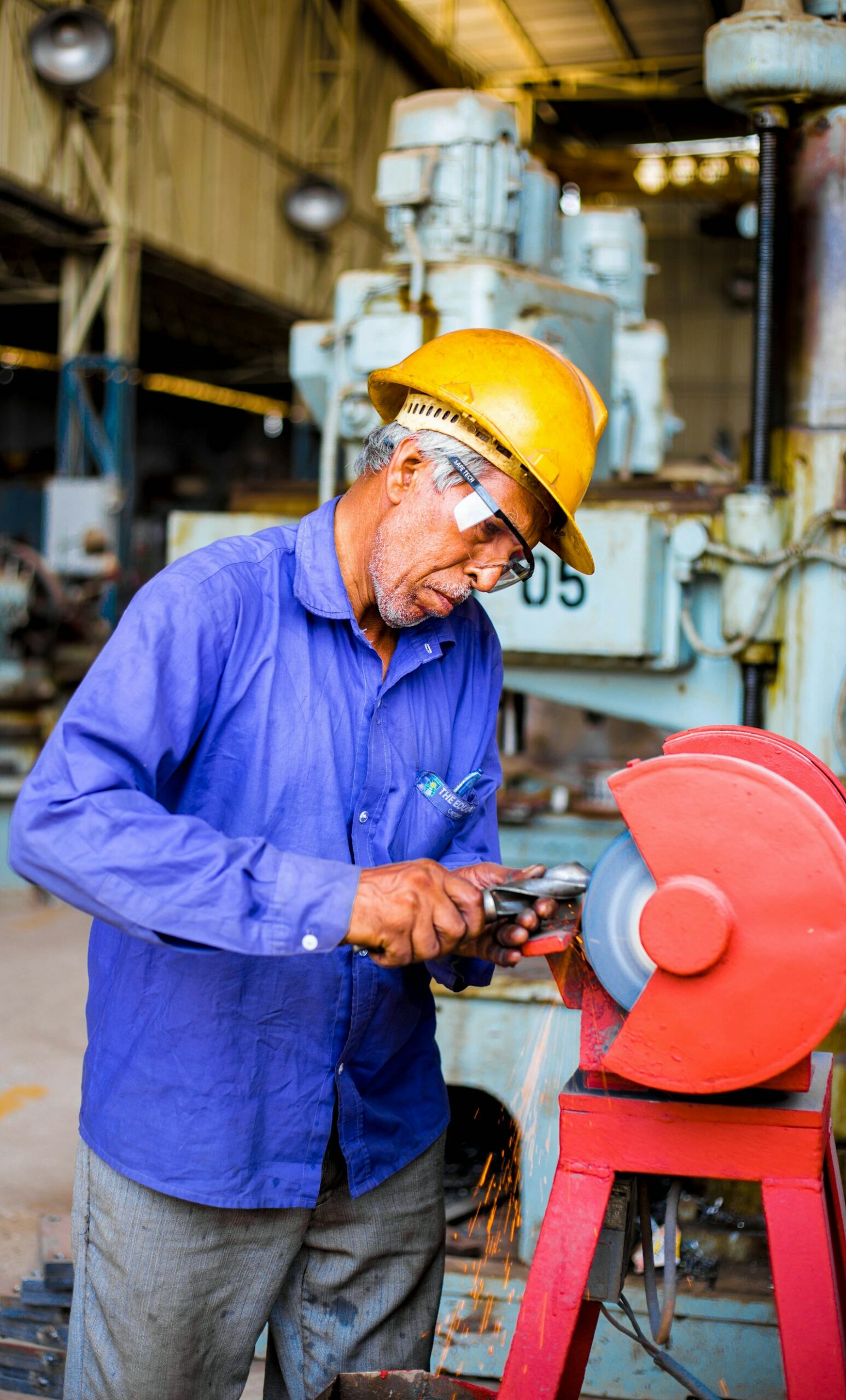 Industrial production line running, operators at their stations